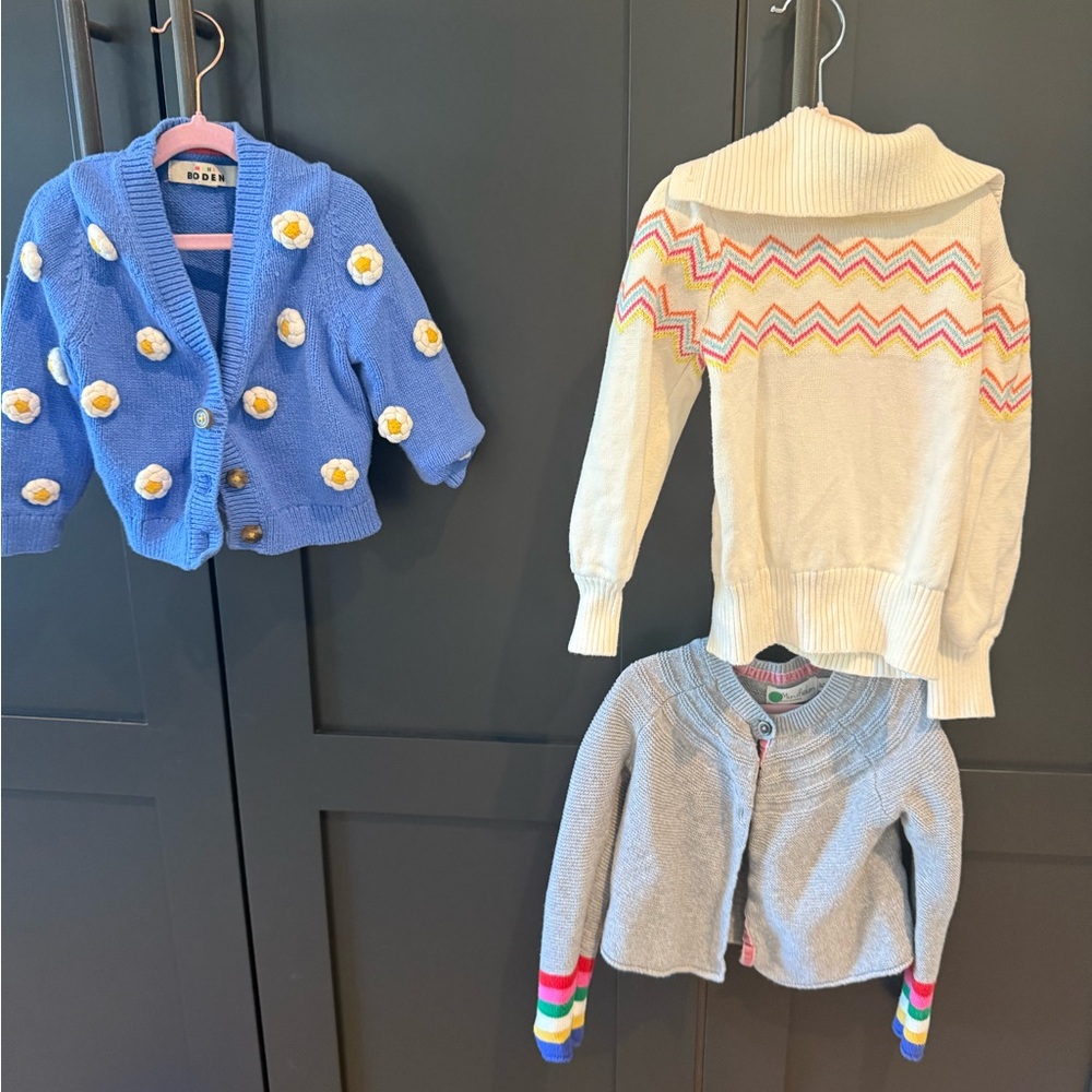 Set of three brightly colored sweaters
